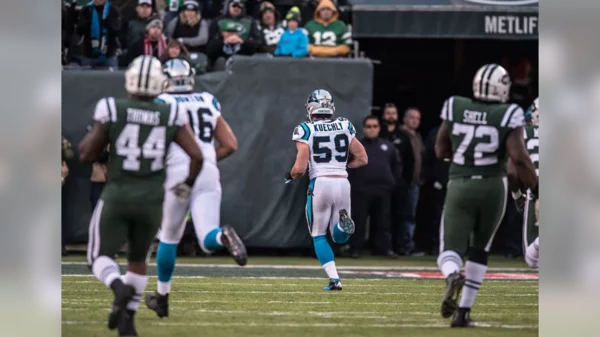 Luke Kuechly with a fumble return for a TD vs the Jets.webp